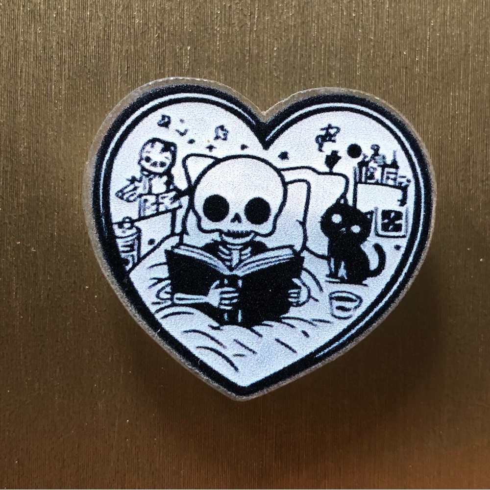 Cute skeleton reading book acrylic pin